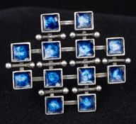 A Marianne Berg for David Andersen sterling silver and blue enamel Silverklang brooch from the