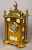 A 19th century lacquered brass cased jasper ware inset mantel clock Of architectural form,