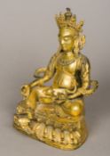 A gilt bronze figure of Buddha Modelled seated wearing a headdress holding a rat and a fruit. 24.