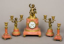 A patinated and gilt bronze mounted rouge marble five piece clock garniture The clock of cut