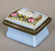 A late 18th/early 19th century enamelled patch box The hinged cover inscribed "A Token of Love" and