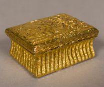 An 18th century gilt metal timepiece box The hinged cover worked with a classical scene and