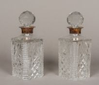 A pair of silver mounted cut glass decanters and stoppers, hallmarked Birmingham 1966,