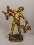 A 19th century Continental gilt bronze figure of a boy holding aloft a pair of geese Standing on a