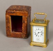 A French miniature brass cased carriage alarm clock Of typical form,