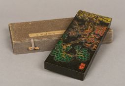 A Chinese ink block Decorated to one side with a tree and seal marks,