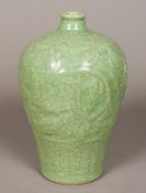 A Chinese porcelain Meiping vase With moulded decoration and allover celadon crackle glaze. 29.