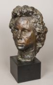 A contemporary patinated bronze sculpture Formed as a female bust,