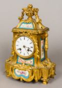 A 19th century porcelain inset gilt bronze mantel clock Set with Sevres style painted porcelain