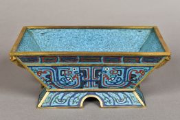 A Chinese cloisonne planter Typically worked, standing on a spreading foot,