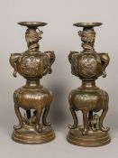 A pair of Japanese late 19th/early 20th century patinated bronze vases Each of double gourd form