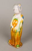 A Chinese Sancai figure Modelled as a woman, her robe with typical glazed decoration. 29 cm high.