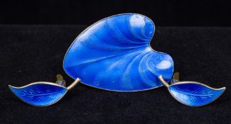 A Norwegian Sterling silver and enamel brooch Of leaf form; a pair of leaf form clip-on earrings;