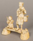 A 19th century Japanese carved ivory group Worked as a salesman with a hand cymbal,