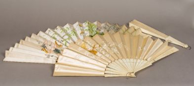 Three 19th century decorated fans, probably French The largest painted with floral sprays,