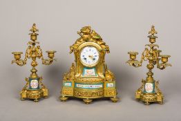 A French gilt and porcelain clock garniture The clock surmounted two doves above the white