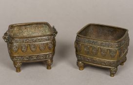 A matched pair of 19th century patinated bronze censers One with twin dog-of-fo mask handles above