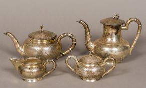 A Chinese silver four piece tea set, the tea set marked for Waikee, Sterling Silver,