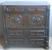 A 17th century oak two part chest of drawers The moulded rectangular top above an arrangement of