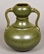A Chinese porcelain twin handled double gourd vase With allover mottle green glaze,