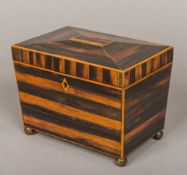 A 19th century zebra wood tea caddy Of sarcophagus form,