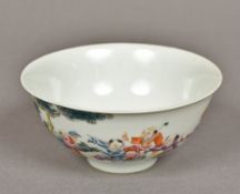 A Chinese porcelain bowl Well painted with children playing in a continuous garden landscape,
