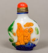A Chinese Peking glass snuff bottle Decorated with deities amongst birds and clouds and with two