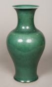 A Chinese porcelain vase Of flared tapering bulbous form with an allover dark turquoise glaze,