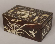 A 19th century Korean mother-of-pearl inlaid lacquered box The removable lid decorated with figures