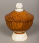 A 19th century ivory mounted carved wooden cup and cover Of domed fluted form with ivory knop