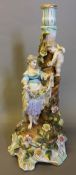 A late 19th/early 20th century "Meissen" porcelain candelabrum base Figurally modelled with cupid