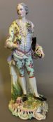 A late 19th/early 20th century "Meissen" porcelain figure of a dandy Modelled standing by an