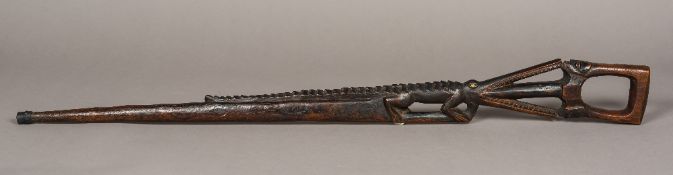 A late 19th/early 20th century unusual African carved wood walking stick Of rifle form,