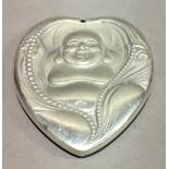 A pendant in the form of Buddha