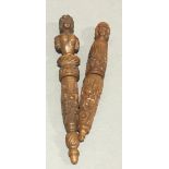 A pair of 18th century carved coquilla nut needle cases
