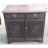 A 19th century carved oak side cupboard