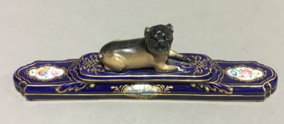 A 19th century Continental porcelain dog form paper weight,