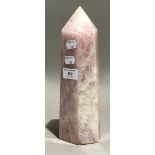 A rose quartz obelisk