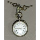 A Swiss silver cased lady's pocket watch with floral decorated white enamelled dial