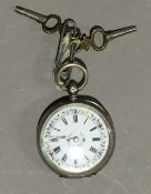 A Swiss silver cased lady's pocket watch with floral decorated white enamelled dial