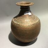 An Eastern copper vase