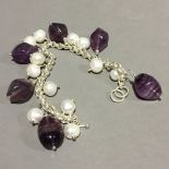 A silver and amethyst bracelet