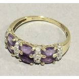 A gold amethyst and diamond ring