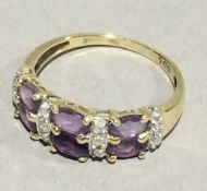 A gold amethyst and diamond ring