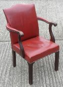 A red leather upholstered mahogany open armchair