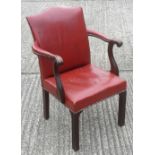 A red leather upholstered mahogany open armchair