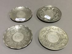 Four Chinese coin dishes