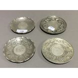 Four Chinese coin dishes