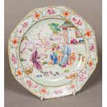 An 18th century Chinese famille rose porcelain dish Painted with a family and chickens in a garden.