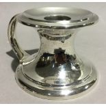 A Scottish silver Arts and Crafts chamberstick, makers Hamilton and Inches,